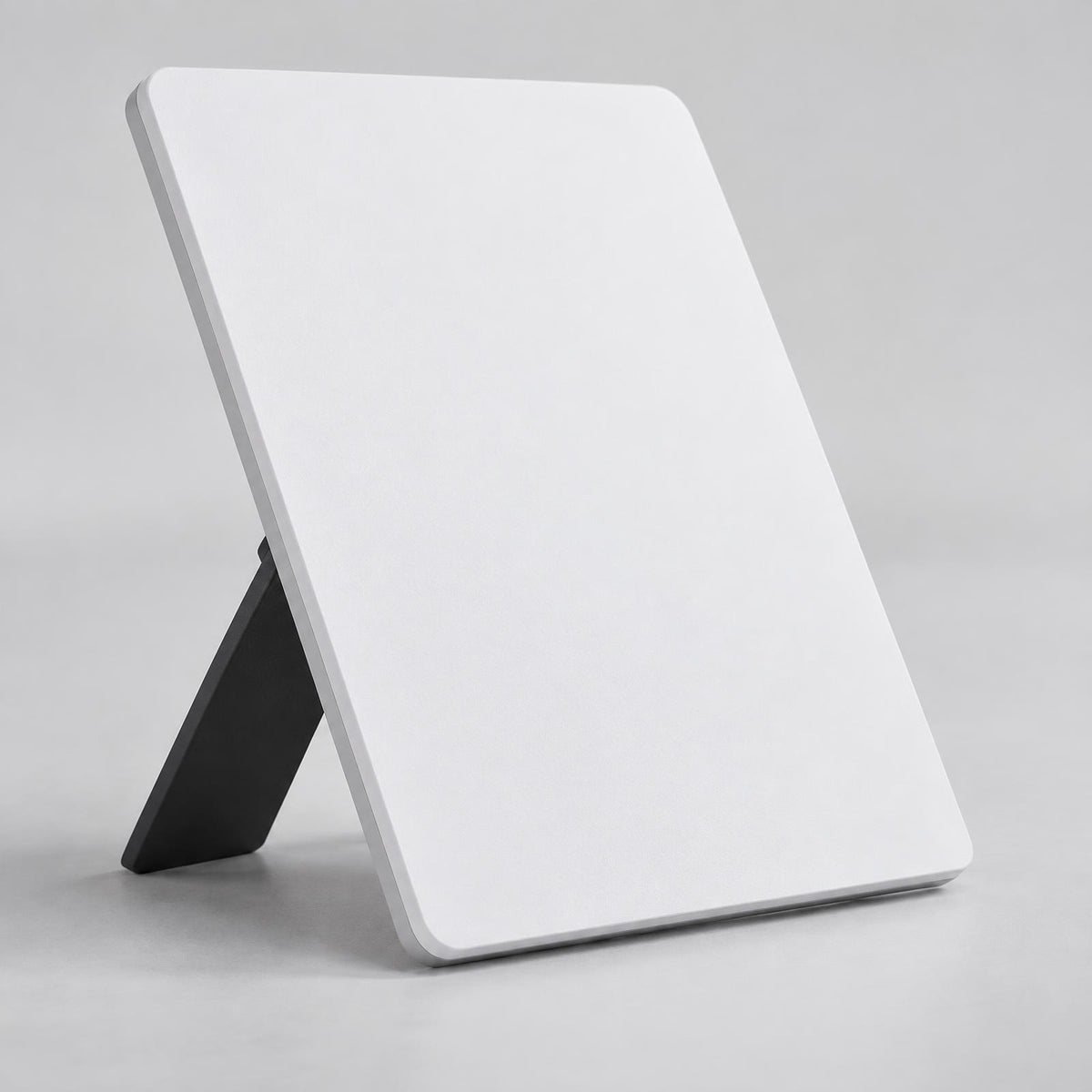 Compact flat white satellite internet terminal with kickstand